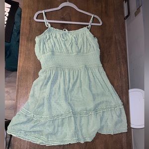 Green boutique mini ruffle trim dress